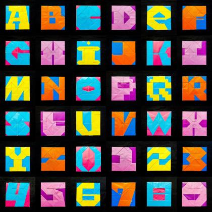 A full Character set composed of the 26 Letters of the Latin Alphabet (A-Z) and the 10 Hindu-Arabic Numerals, all folded from the fröbel base.